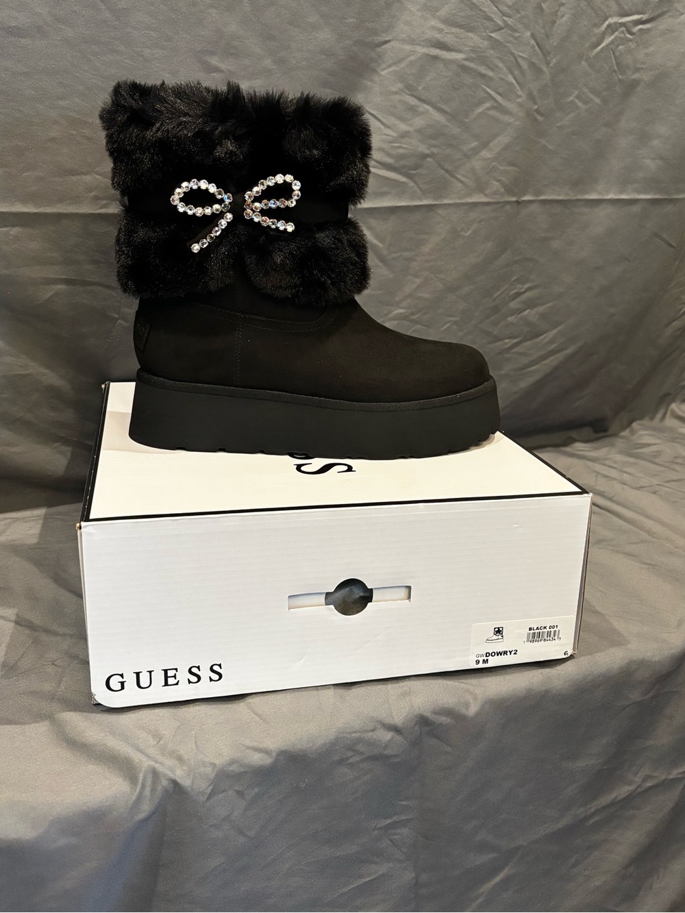 GUESS Black Faux Fur Platform Boot with Crystal Bow Accent